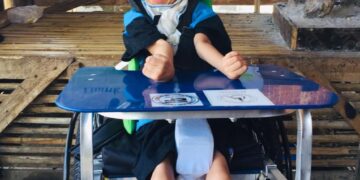 Novi, gadis 12 tahun menunjukan senyum bahagia menerima Wheelchairs For Kids (WFK) Kursi Roda Anak pertamanya